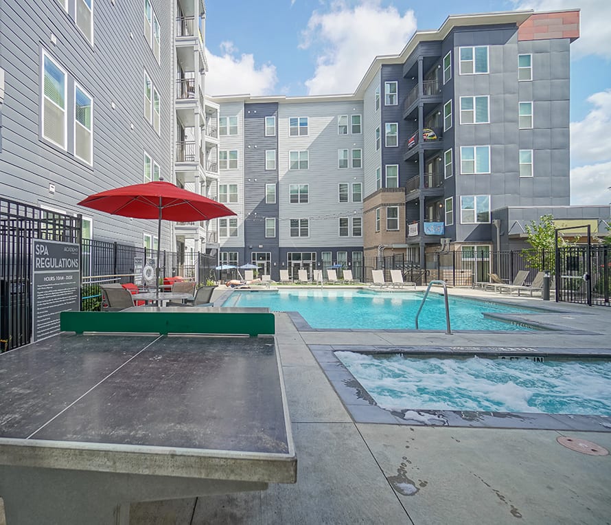 resort style pool with ping pong table